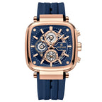 Luxury watch with blue strap and rose gold case on white background